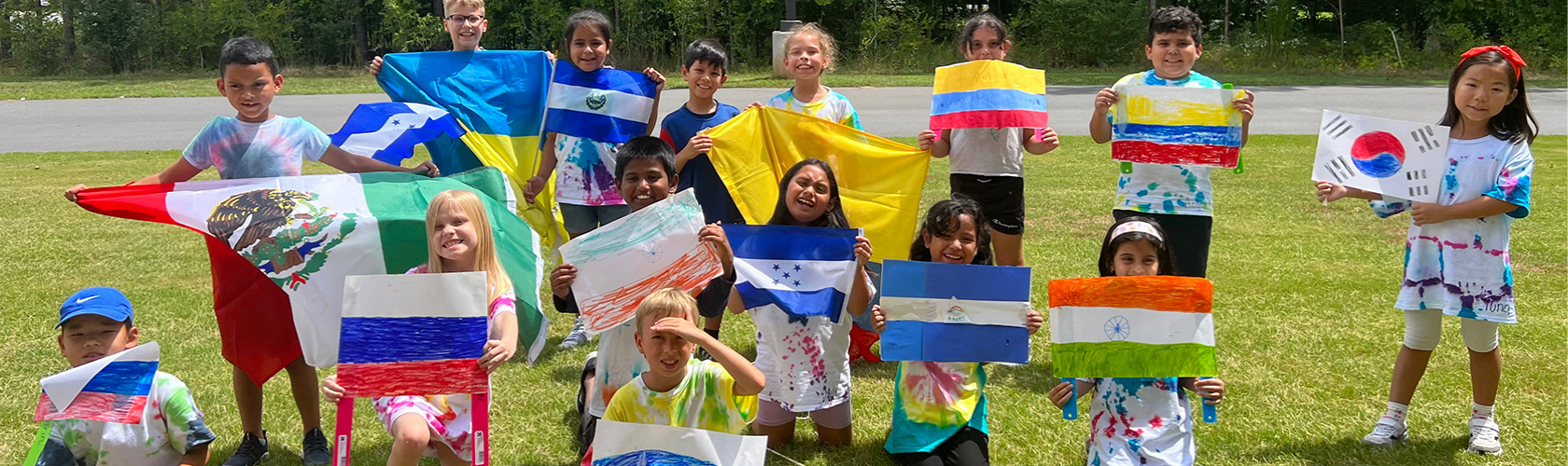 diverse kids holding flags from their countries